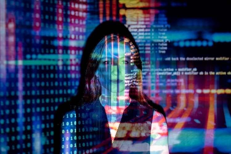 A figure overlaid with streams of code and data, evoking the blurred line between media and machine intelligence.