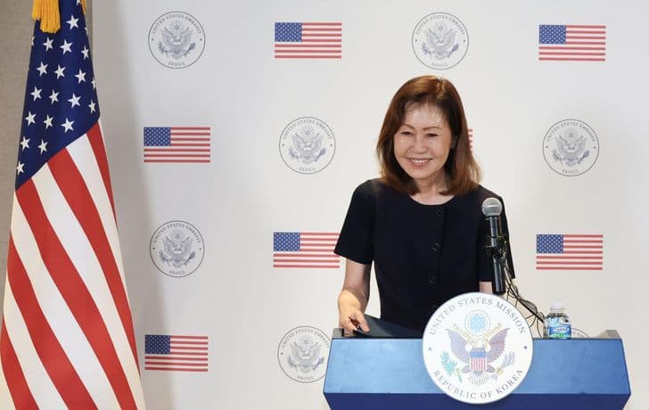 US Ambassador Michelle Steel smiles at a lectern before American flags at the US Mission in Seoul.