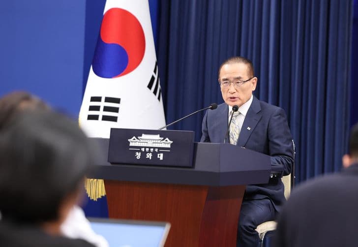 National Security Adviser Wi Sung-lac speaks at a podium marked Cheong Wa Dae during a press briefing.